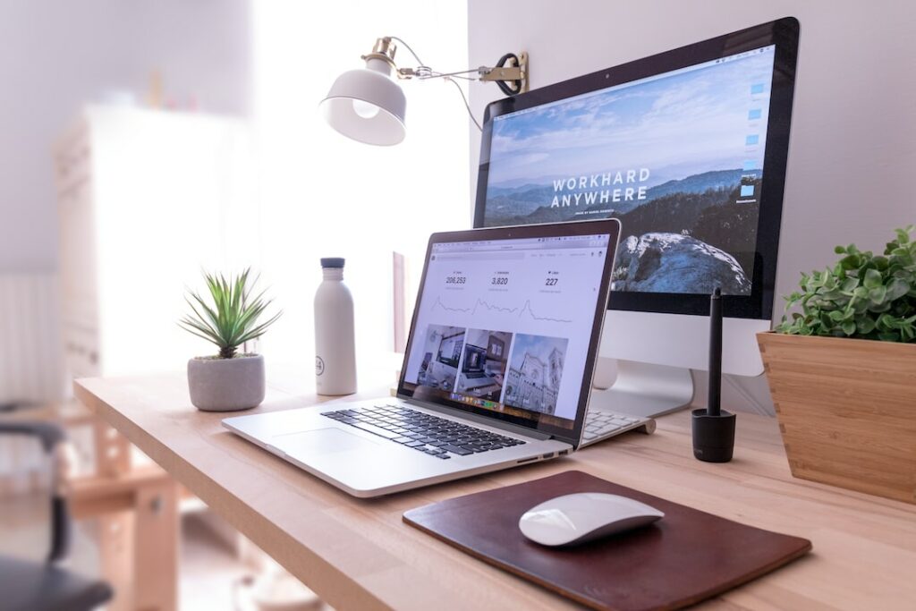 computer desk setup with a mac and iMac